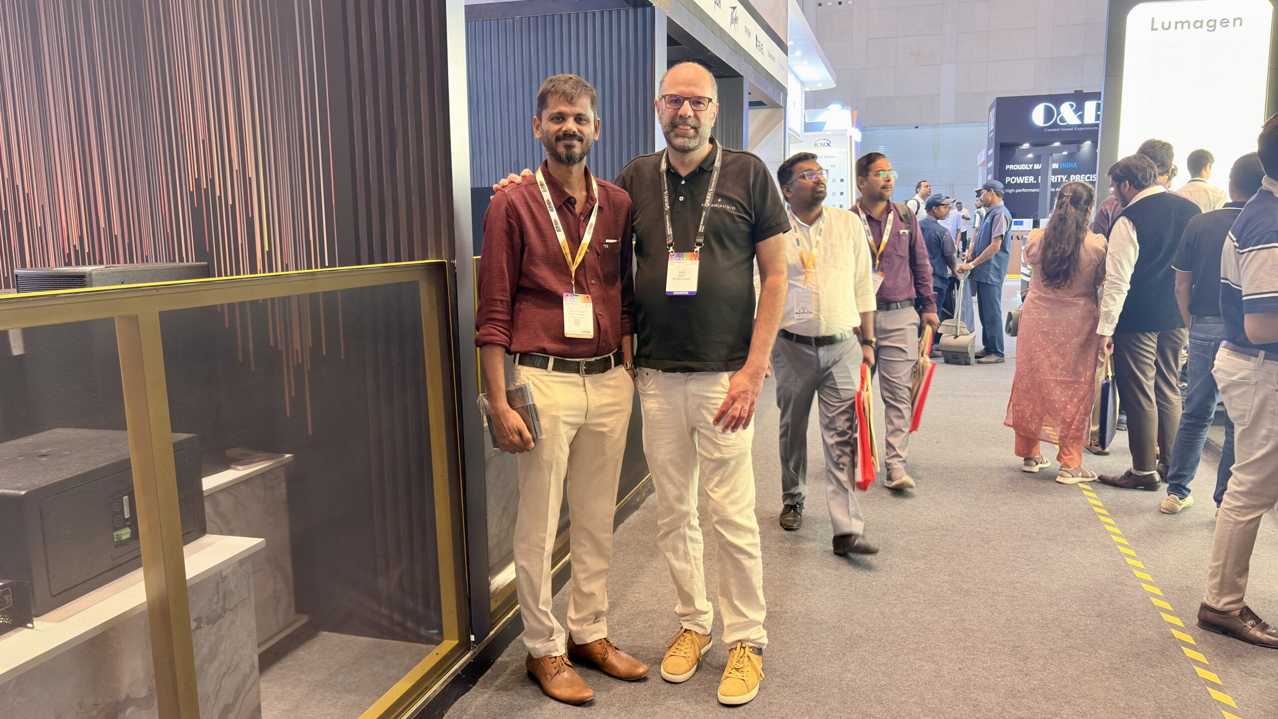 Gaël Sicot StormAudio calibration specialist discussing 11.8.6 immersive audio system setup at Smart Home Expo 2026 Mumbai booth E30